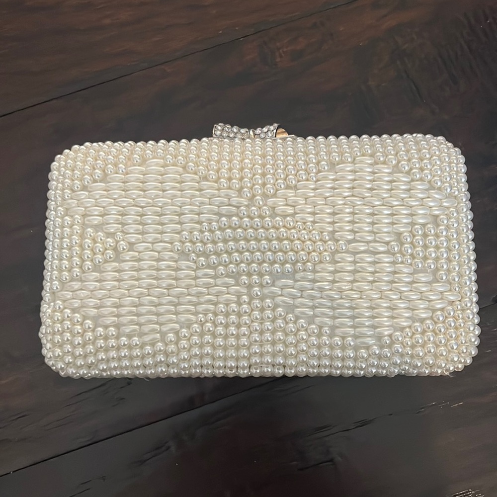 New with tags. Pearl evening bag with silver chain and crystal bow clasp